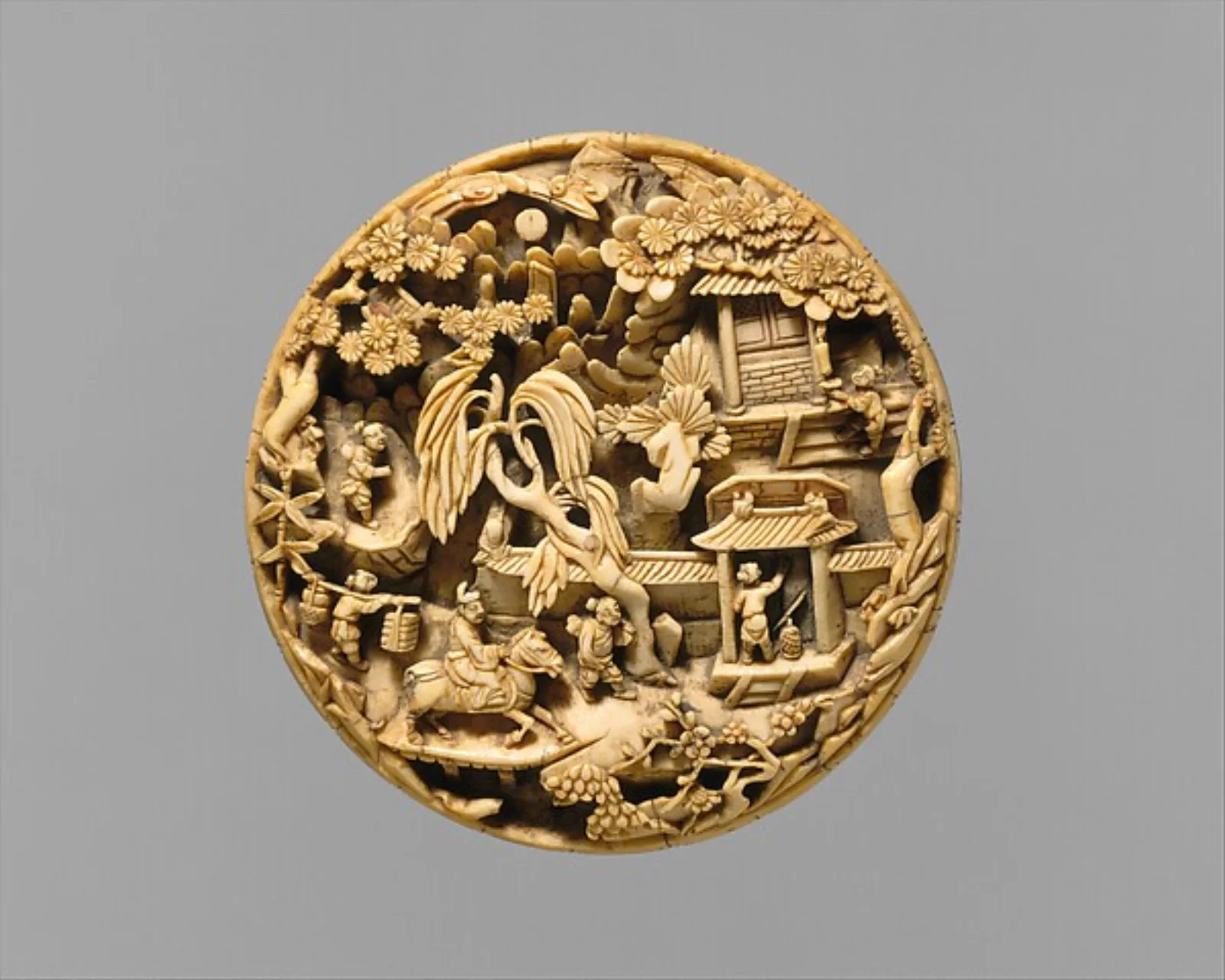 Late-Ming ivory medallion showing a return from a spring outing.